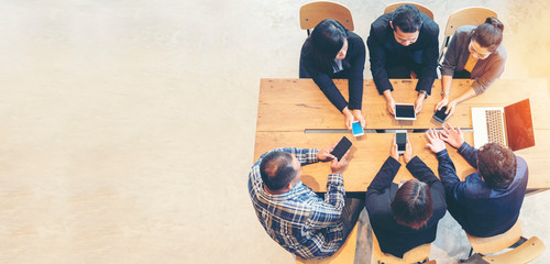 Unified Collaboration Marketing Team Collaborate in office meeting. Group of people using...