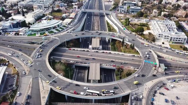 Aerial bird's eye video taken by drone of highway and multilevel junction ring road passing through urban city centre