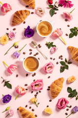 Morning coffee, croissants and a beautiful flowers . Flat lay style.