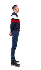 Side view of a stylish man in a sweater.