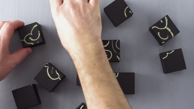 Top view on man's hand connecting wooden blocks iinto abstract human brain. Creative, business or medical concept.