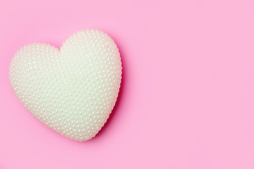 Greeting card on pink background. Selective focus. Valentines day, Womens day, Mothers day. Background with copy space. Horizontal.