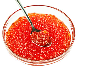 Red caviar in a glass container. Isolated object on white background.