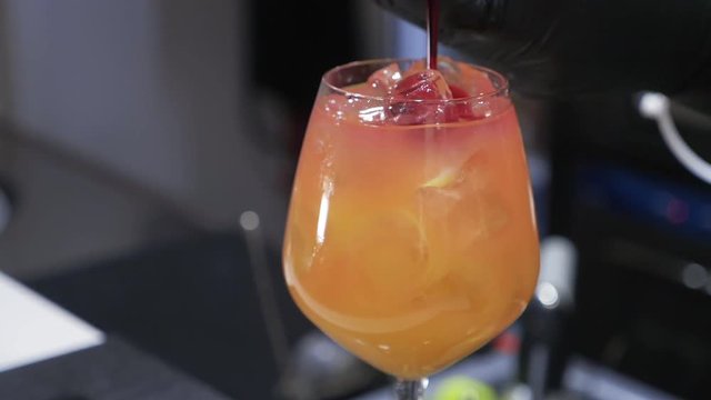 Barman preaparing negroni drink at bar counter-slow motion