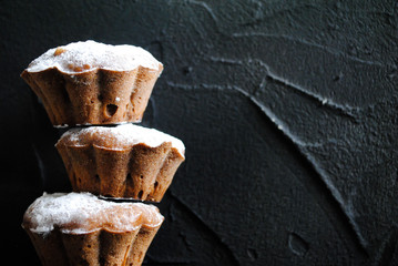 Chocolate cupcakes on a black background