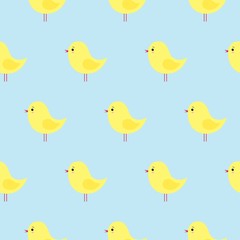 Vector seamless pattern with cute yellow Easter chickens on a blue background. kawaii