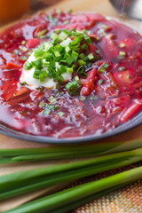 Borsch with sour cream and greens. Dinner. Red soup. Proper healthy eating.