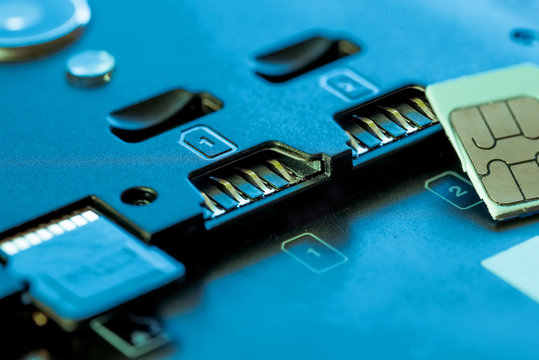 SIM Card Slot with Micro SIM Card. Concept of Exchanging New Phone Number. Selective Focus