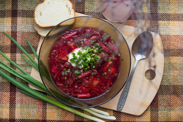 Borsch with sour cream and greens. Dinner. Red soup. Proper healthy eating.