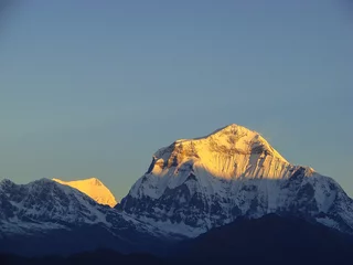 Crédence en verre imprimé Dhaulagiri Annapurna mountain peaks in sunrise light. Snowy white peak. Trekking route to Annapurna - Nepal, Himalaya.