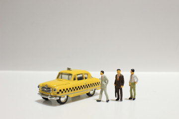  Old retro toy yellow taxi isolated on white background