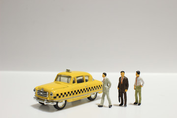  Old retro toy yellow taxi isolated on white background
