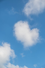The blue sky with hearts shape clouds.