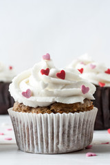 Delicious Valentine Day cupcake on white background