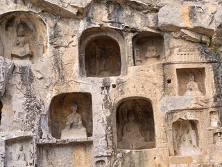 Luoyang Longmen grottoes. Broken Buddha and the stone caves and sculptures in the Longmen Grottoes in Luoyang, China. Taken in 14th October 2018