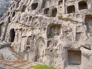 Luoyang Longmen grottoes. Broken Buddha and the stone caves and sculptures in the Longmen Grottoes in Luoyang, China. Taken in 14th October 2018