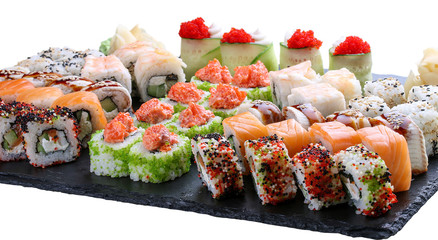 Sushi set on ceramic boards. On white background