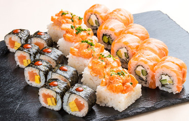 Sushi set on ceramic boards. On white background