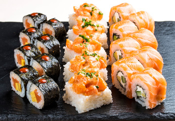 Sushi set on ceramic boards. On white background