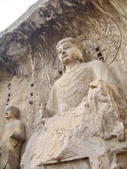 Obraz premium Luoyang Longmen grottoes. Broken Buddha and the stone caves and sculptures in the Longmen Grottoes in Luoyang, China. Taken in 14th October 2018