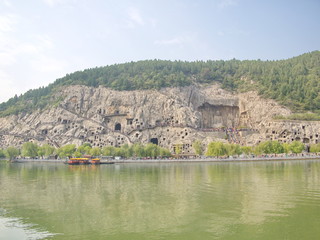 Luoyang Longmen grottoes. Broken Buddha and the stone caves and sculptures in the Longmen Grottoes in Luoyang, China. Taken in 14th October 2018