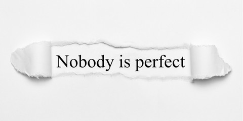 Nobody is perfect on white torn paper