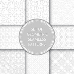 Compilation of seamless patterns. Gray abstract and geometric prints on white backgrounds