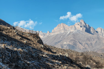 The ruins of an ancient mountain village with many fences built of stones