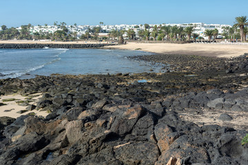 Stones opening during the low tide. Beach in Costa Teguise.