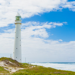 Lighthouse on a rugged coastline during the daytime