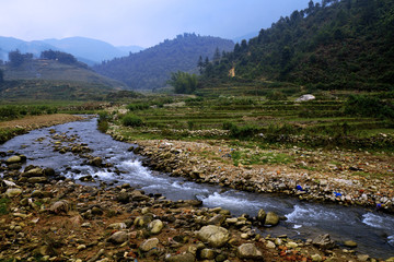 Beautiful landscape with green field on mountains and cloudy sky in Sa Pa, Vietnam
