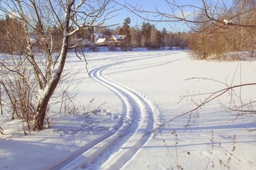 Obraz premium snow winter road, winter landscape, the track of the carriage