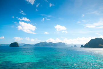 Fototapeta premium Sea, islands and rocks in the blue water and sky