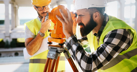 Fototapeta na wymiar Portrait of construction engineers working on building site