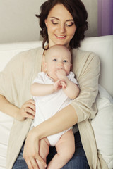 Fototapeta na wymiar Portrait of happy mother and baby 