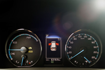 Hybrid car dashboard speedometer .
