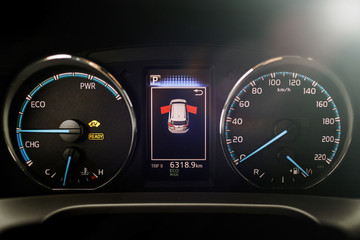 Hybrid car dashboard speedometer .