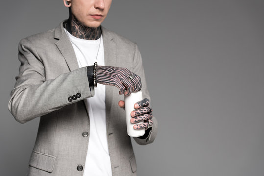 Cropped Shot Of Tattooed Man In Suit Jacket Opening Aluminum Can Isolated On Grey