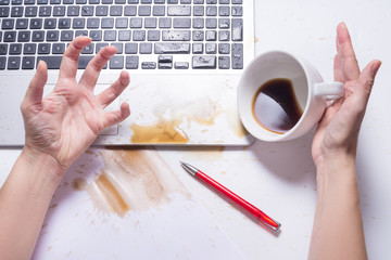 Spill coffee on a computer keyboard