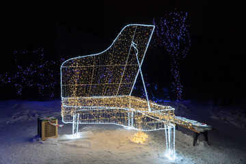 Christmas light decorations glowing piano