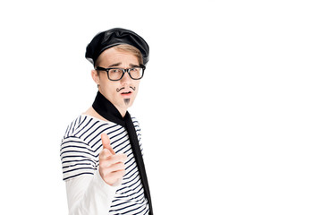 french man in glasses and black beret pointing with finger isolated on white