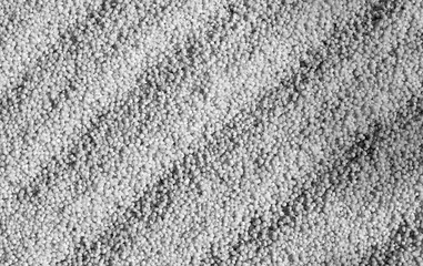 Millet groats close-up in black and white.