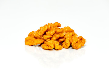 Peeled walnut closeup. Golden walnut on a white background. Useful products for vegetarians.
