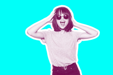 Collage in magazine style with colorful emotional fashion girl in t-shirt and sunglasses scream holding her head toned blue background