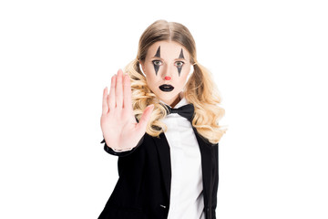 blonde female clown showing stop gesture isolated on white