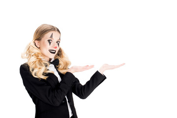 attractive blonde clown showing welcome gesture isolated on white