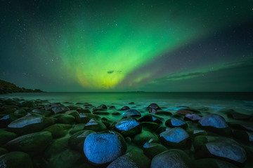 Lofoten aurora above moutains and sea