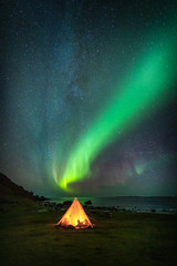 Lofoten aurora above moutains and sea