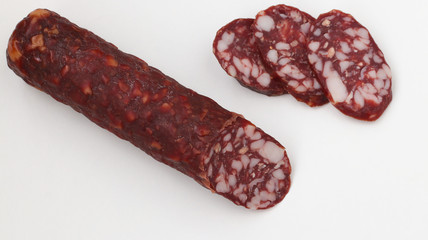 Smoked sausage on white background, copy space 
