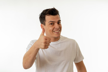 Human expressions and emotions. Young attractive man with a happy face, smiling and celebrating